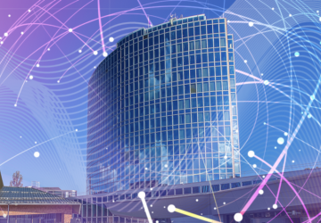 Una imagen intervenida del edificio de la OMPI con un globo terráqueo digital dibujado a su alrededor.