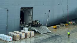 Supplies are being unloaded from a ship. 