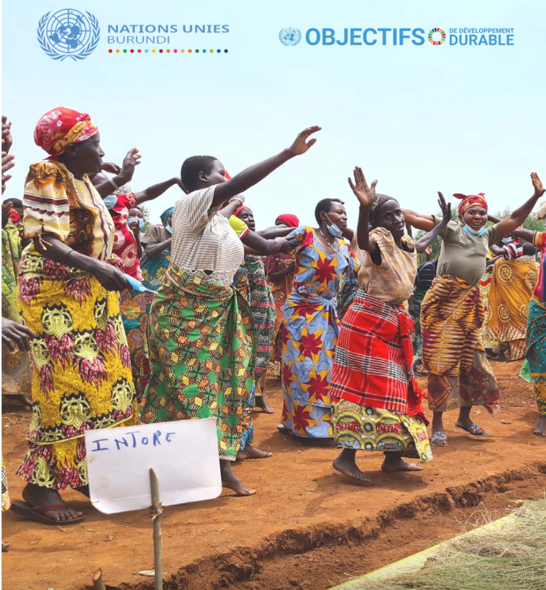 Publication cover featuring women in traditional clothes dancing in a field.