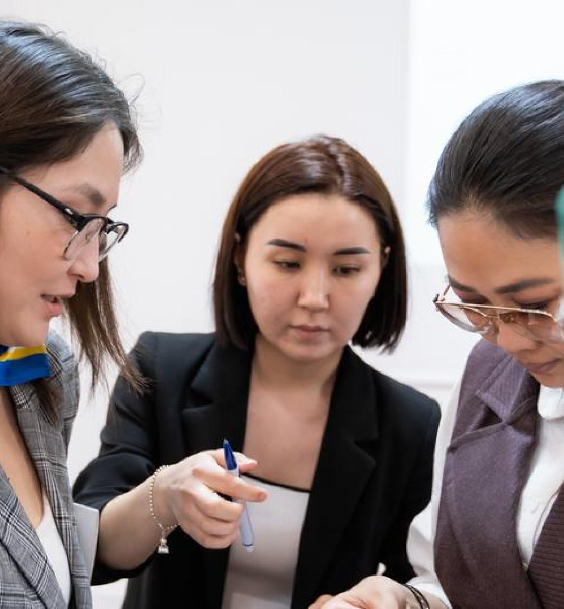 Four women at a training for consultants of Women's Entrepreneurship Development Centers.