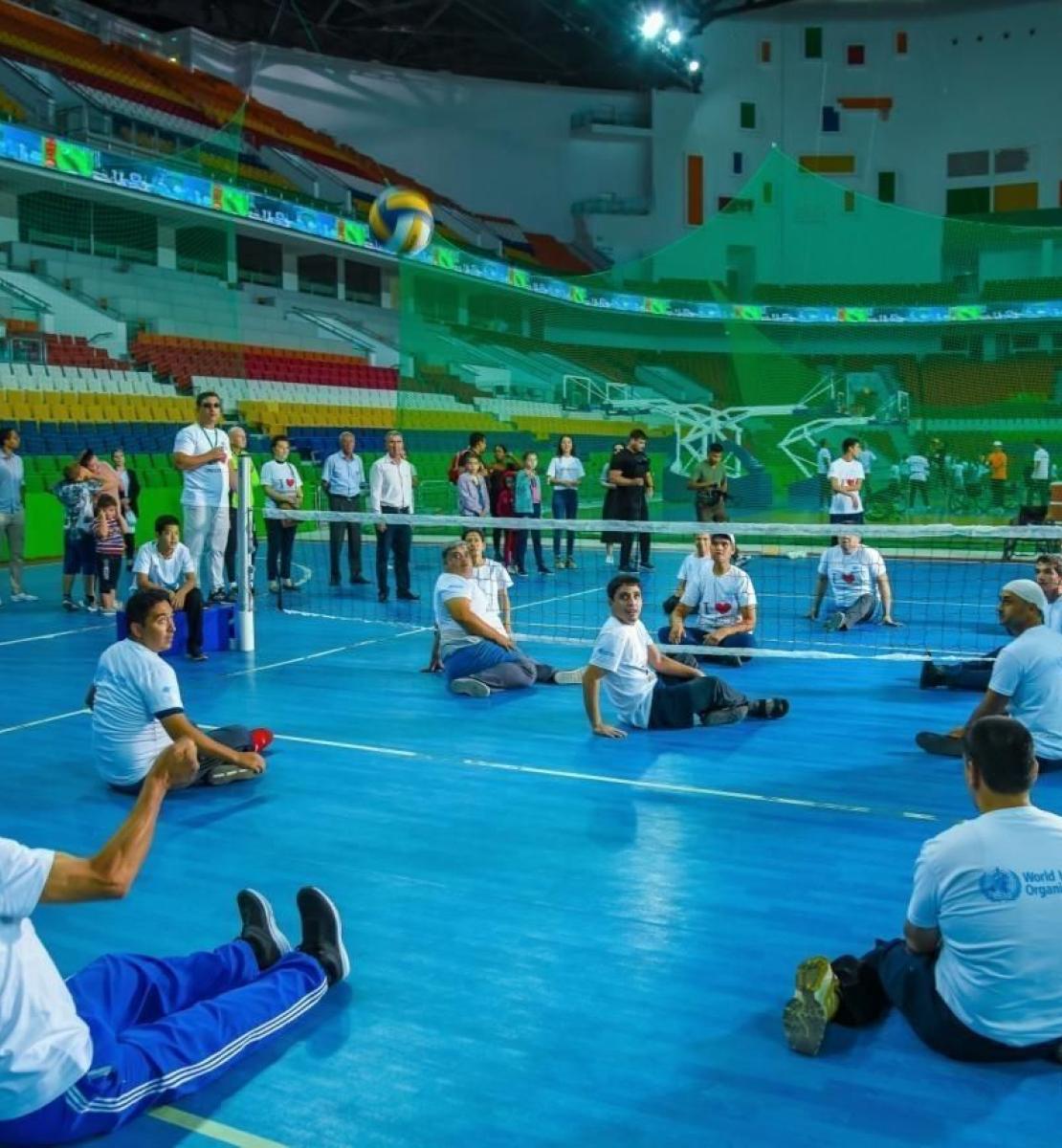 Players with disabilities playing volleyball. 