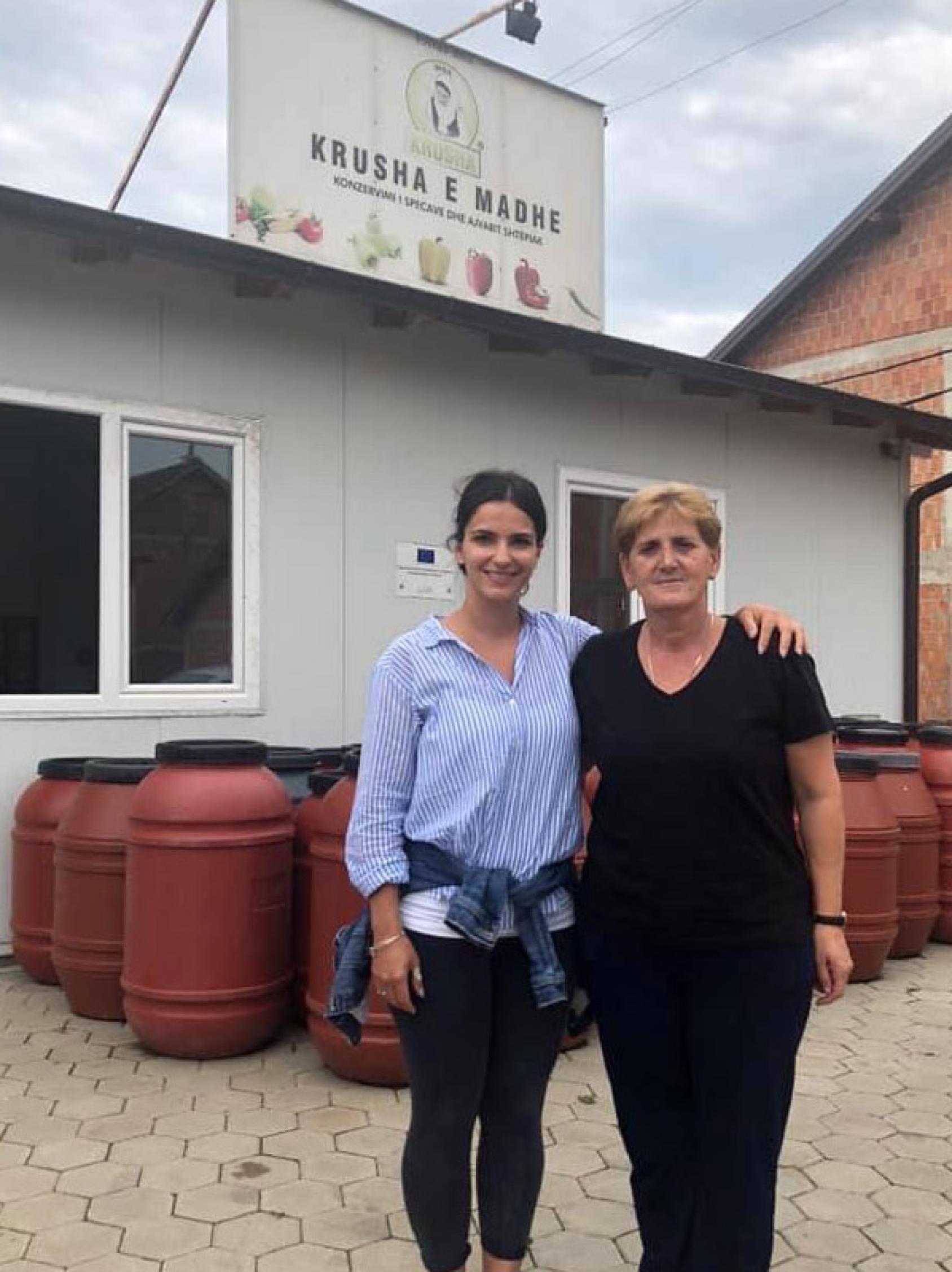 Yllka Gashi (the actor that portrays Fahrie Hoti in the movie Hive) and Fahrie Hoti in front of the pickled peppers production unit.