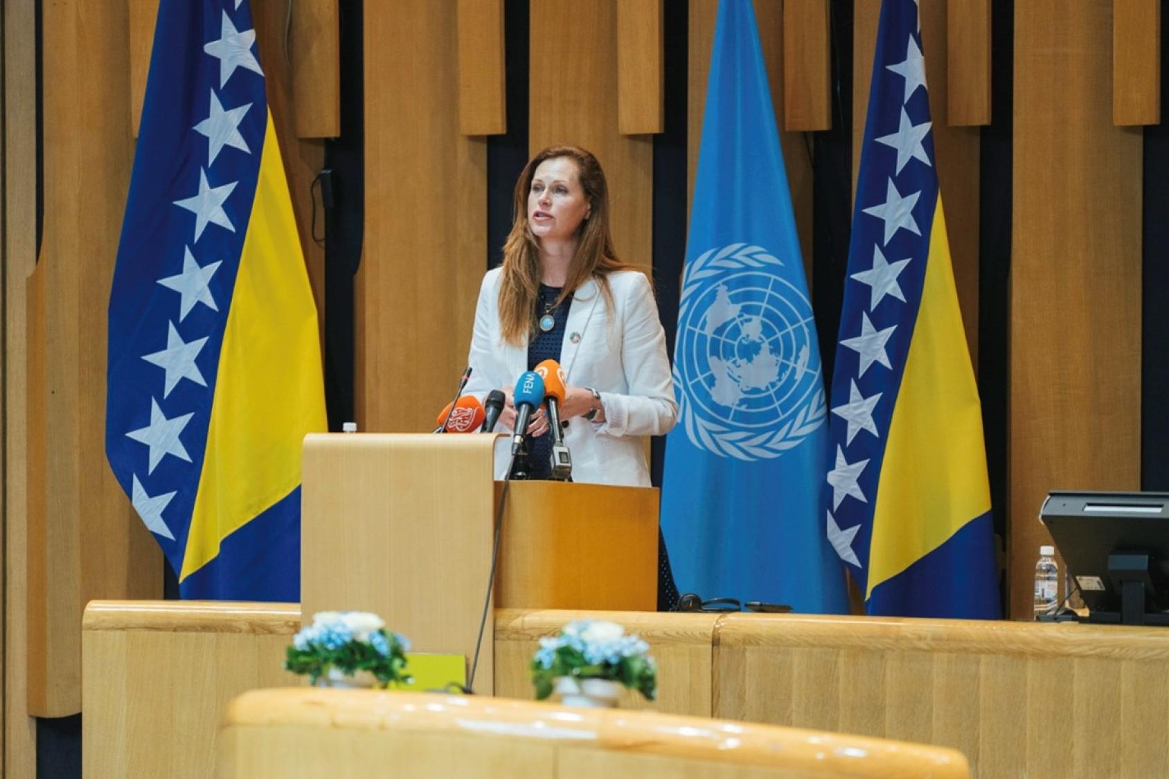 UN Resident Coordinator in Bosnia and Herzegovina, Ingrid Macdonald stands at the podium at the Parliamentary Assembly to give a speech on BiH’s contribution to the UN over the last 30 years. 