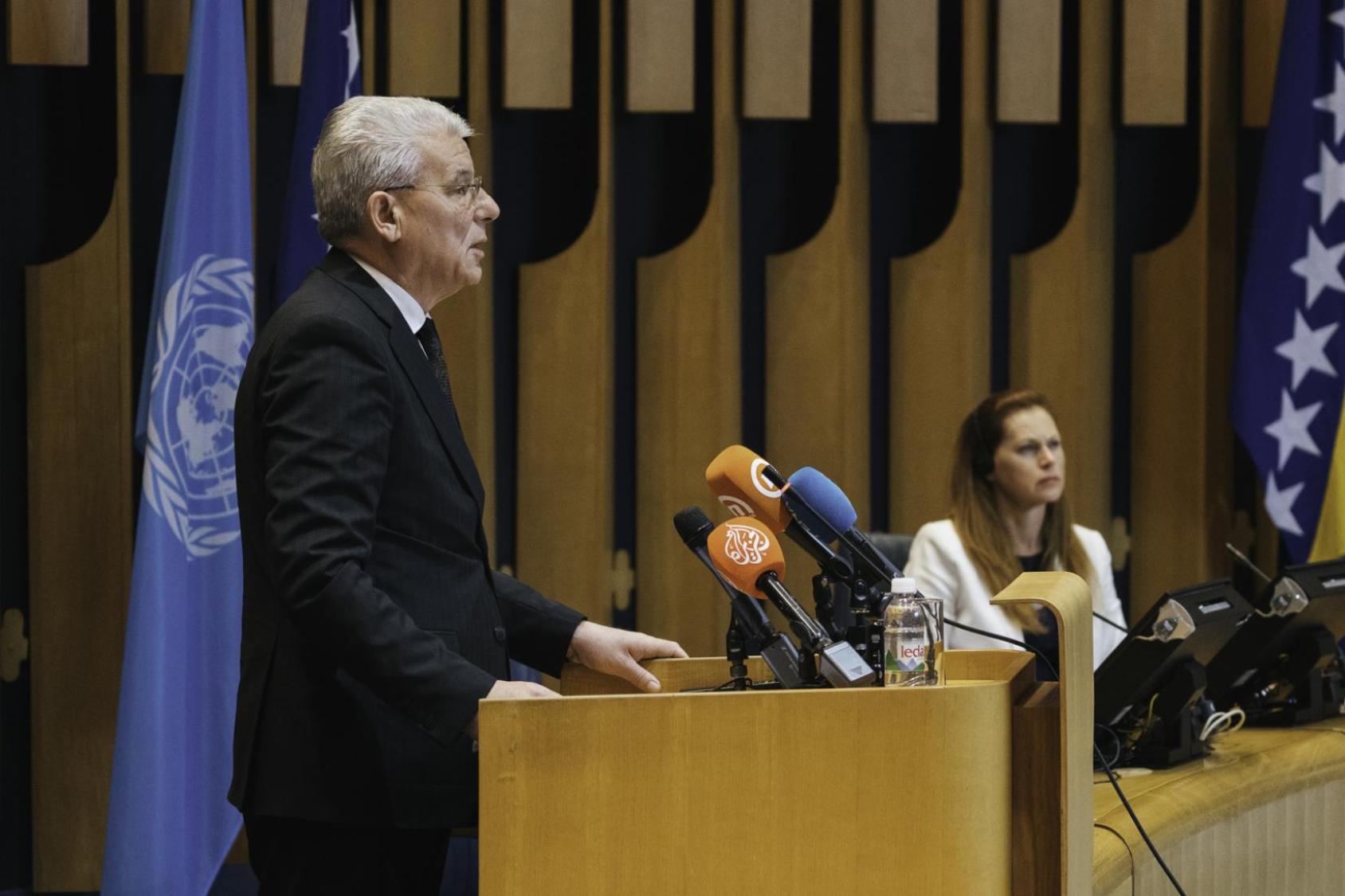 The Chairman of the Presidency of Bosnia and Herzegovina, HE Šefik Džaferović stands at the podium to deliver opening remarks at the 30th anniversary ceremony.