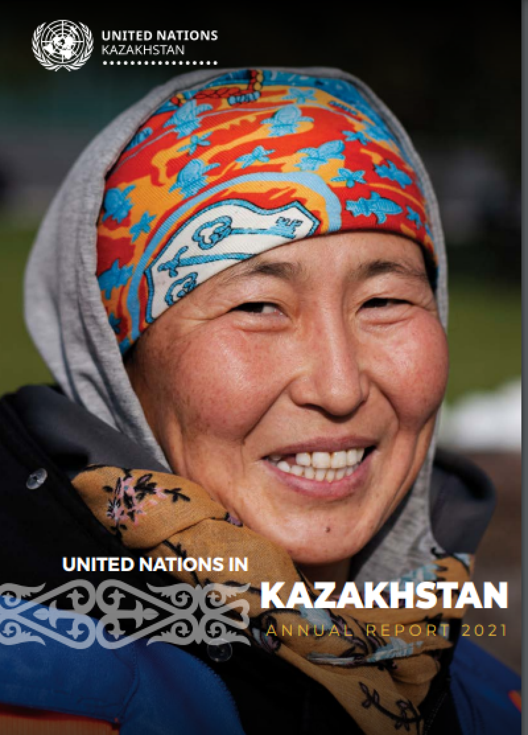 A woman in a colorful headscarf smiles brightly, as a report cover. 