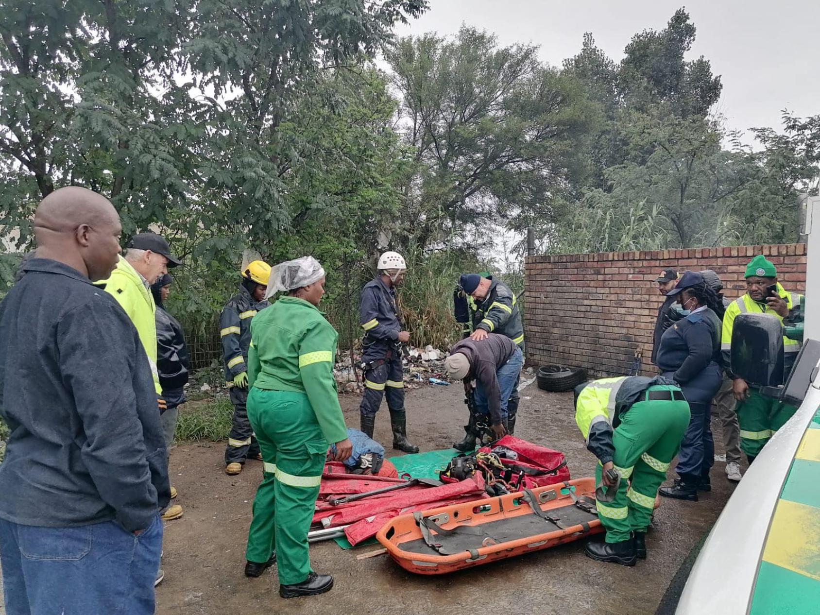 Rescue workers in green outfits 