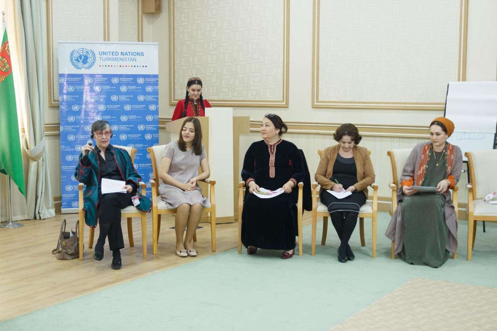 Five women sitting at an informal panel discussion