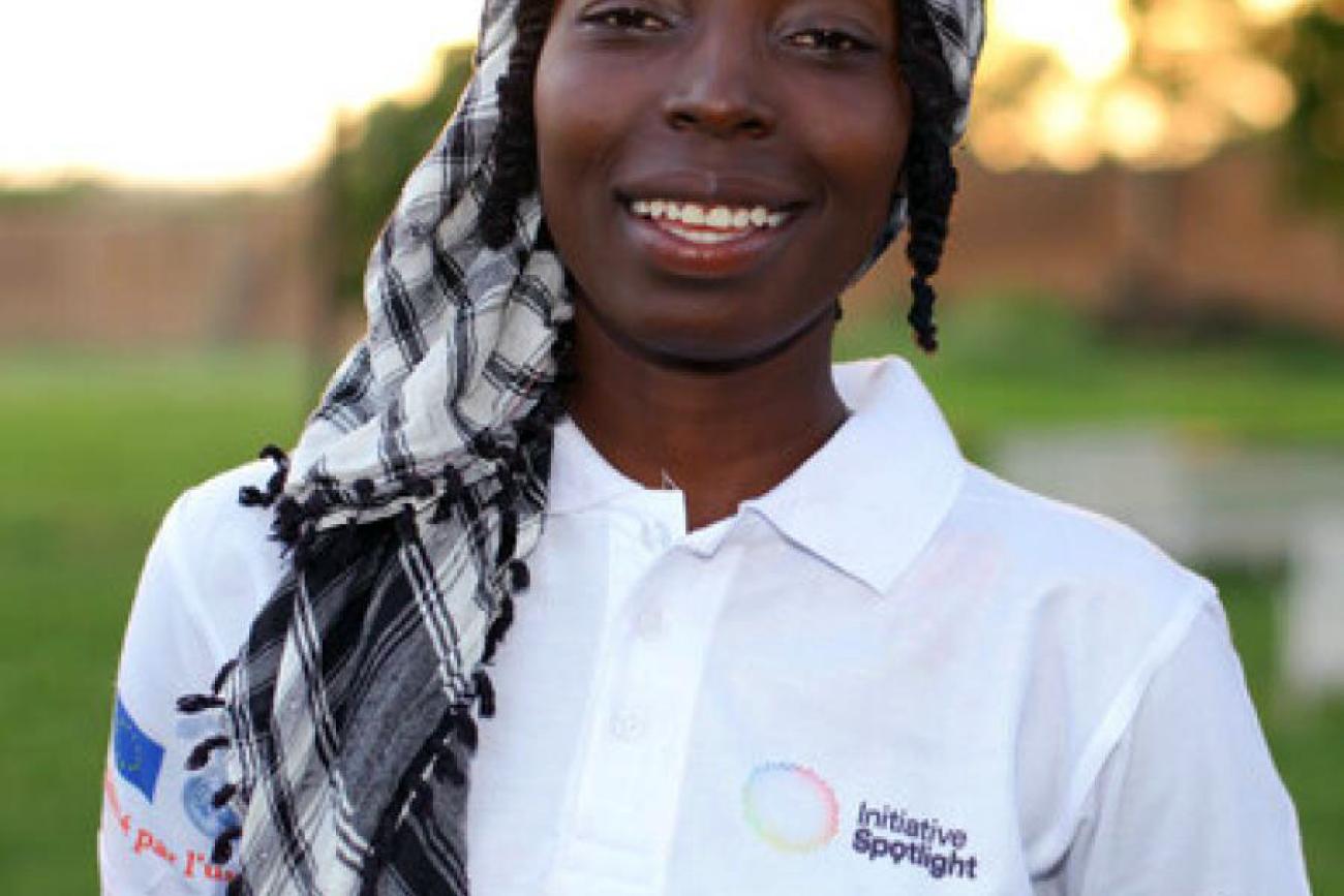 Photo of poet, Hama Daouda  Fatouma, wearing a white polo Spotlight Initiative shirt.