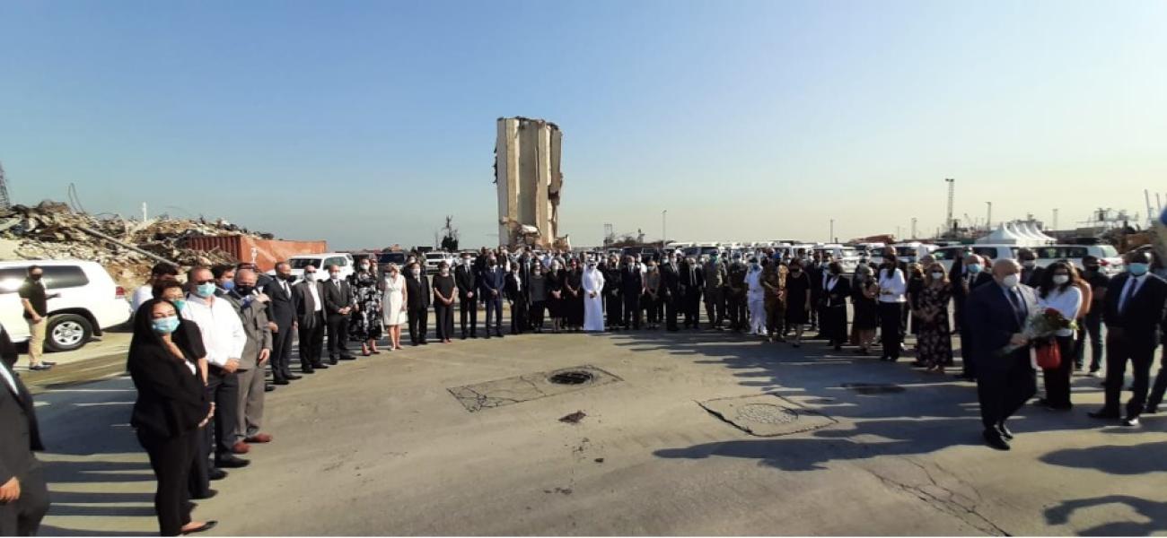United Nations staff and Diplomatic Corps in Lebanon stand side by side outside as they observe a moment of silence in honour of the people who died in the Beirut port explosions. 