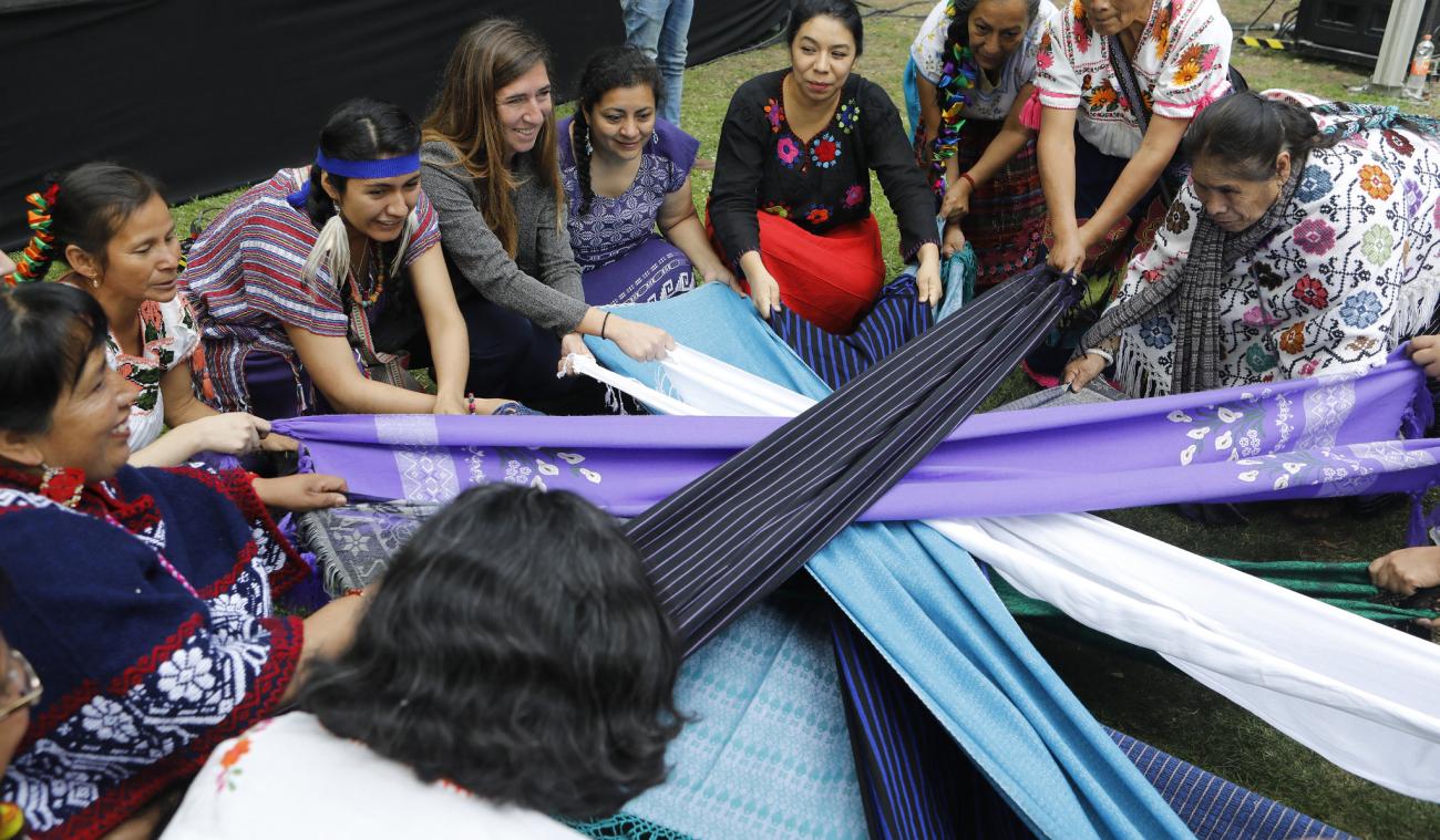Indigenous women's group members hold several pieces of fabric in a circular shape. It's part of a performance for the opening ceremony to kick off the Generation Equality Forum in Mexico. The ceremony was held at the Complejo Cultural Los Pinos in Mexico City on 29 March 2021.