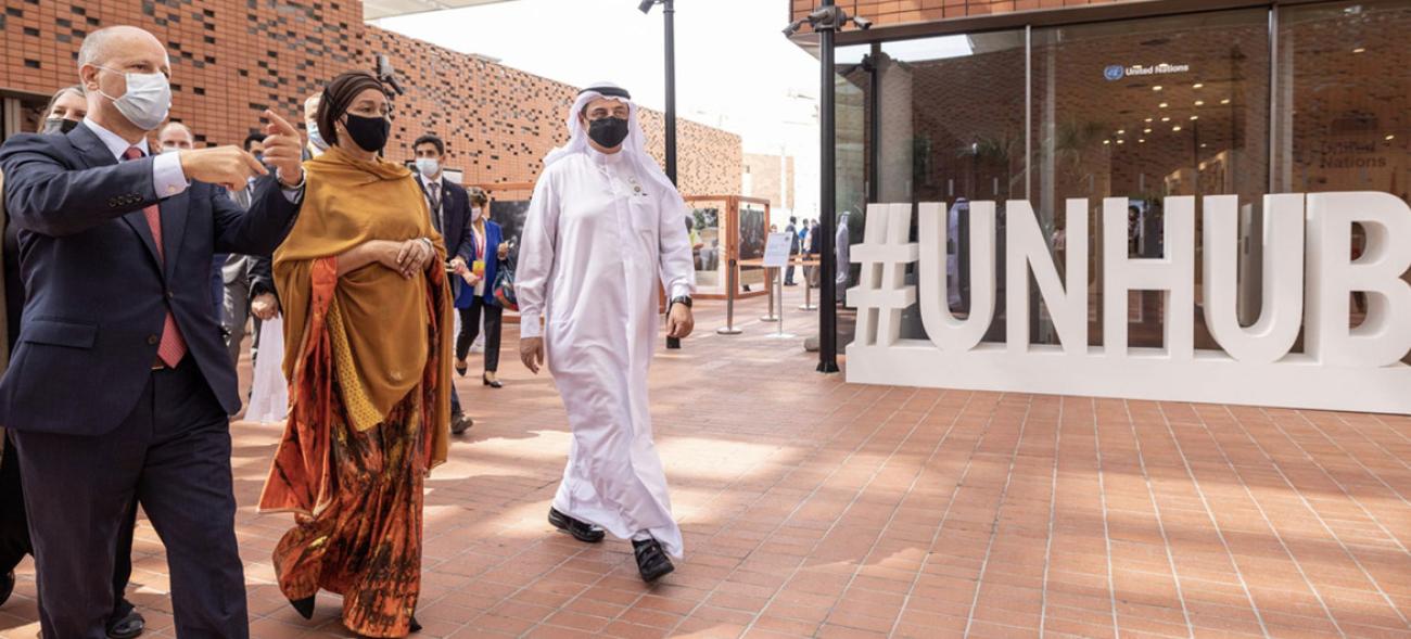 The Deputy Secretary-General Amina Mohammed walks outside the EXPO facilities with other officials.