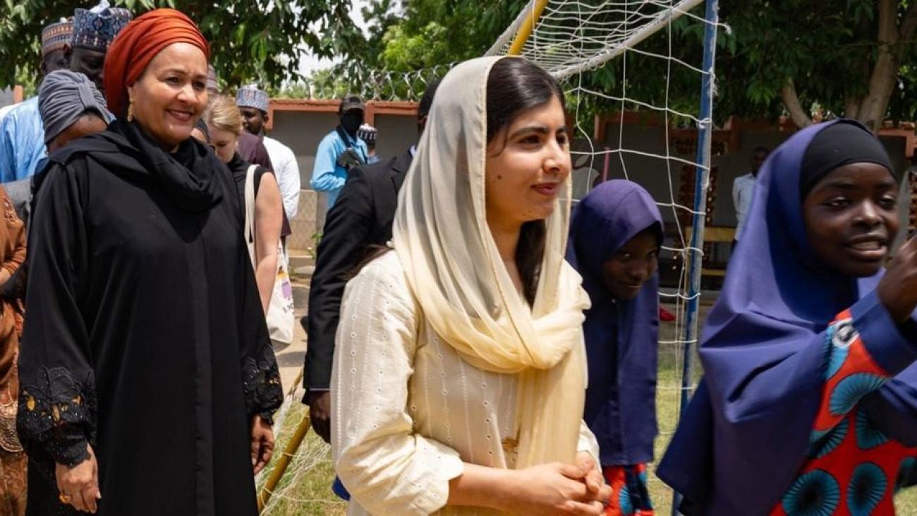 UN Deputy chief and Malala Yousafzai appear to be walking at an event