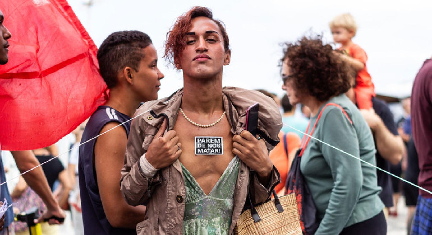 WellDonna Taiz Coelho advocates for her rights on the streets of Rio de Janeiro. The sticker on her chest reads "stop killing us."
