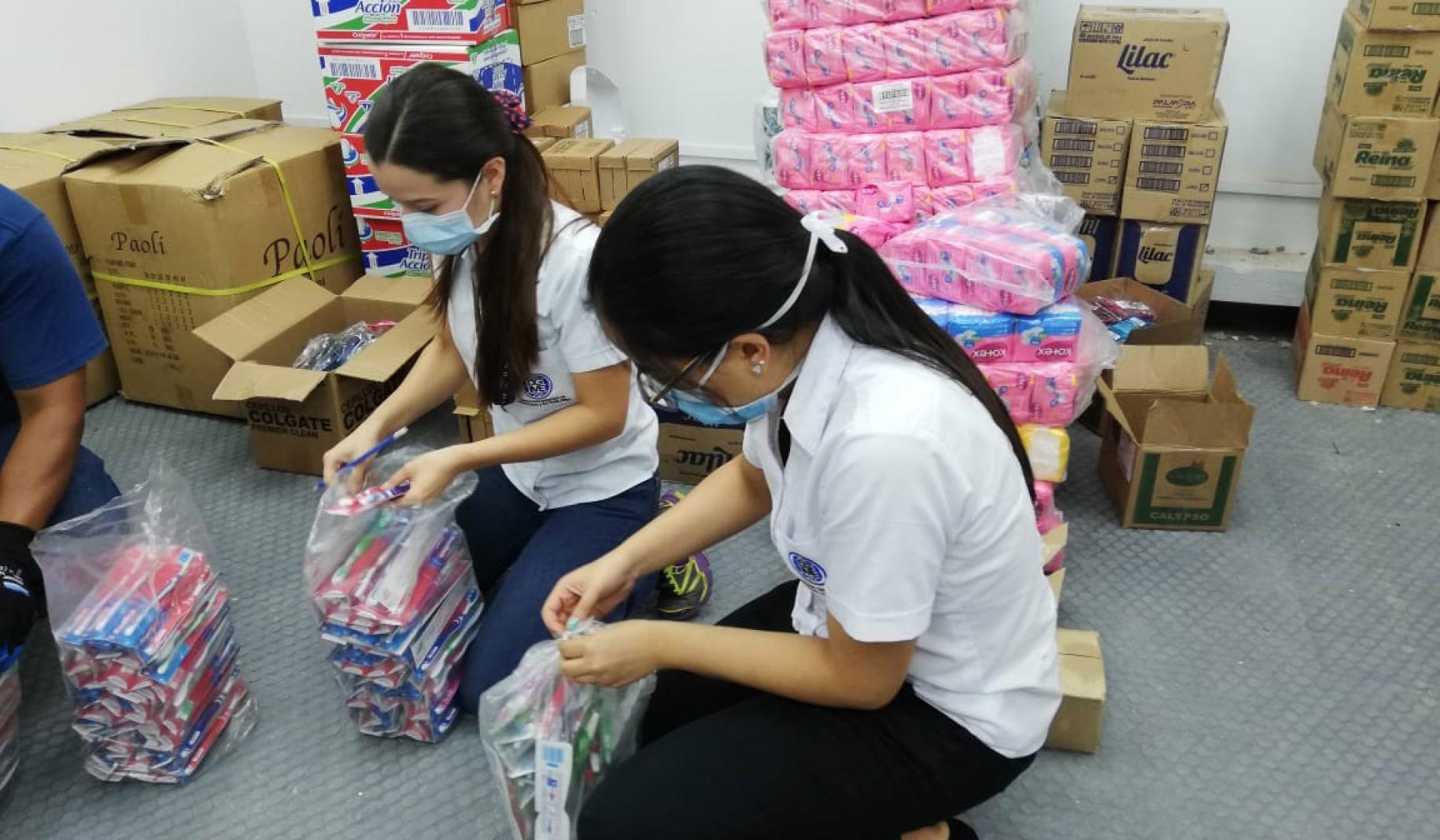 Toothbrushes and manstrual pads are sorted to pack dignity kits for women in prisons and quarantine centres. 