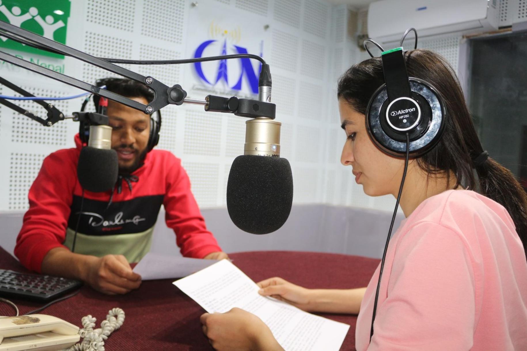 Two hosts of a radio program provide messages on COVID-19 symptoms and preventive measures, positive stories, mental wellbeing respect and care for returnees/migrants. 