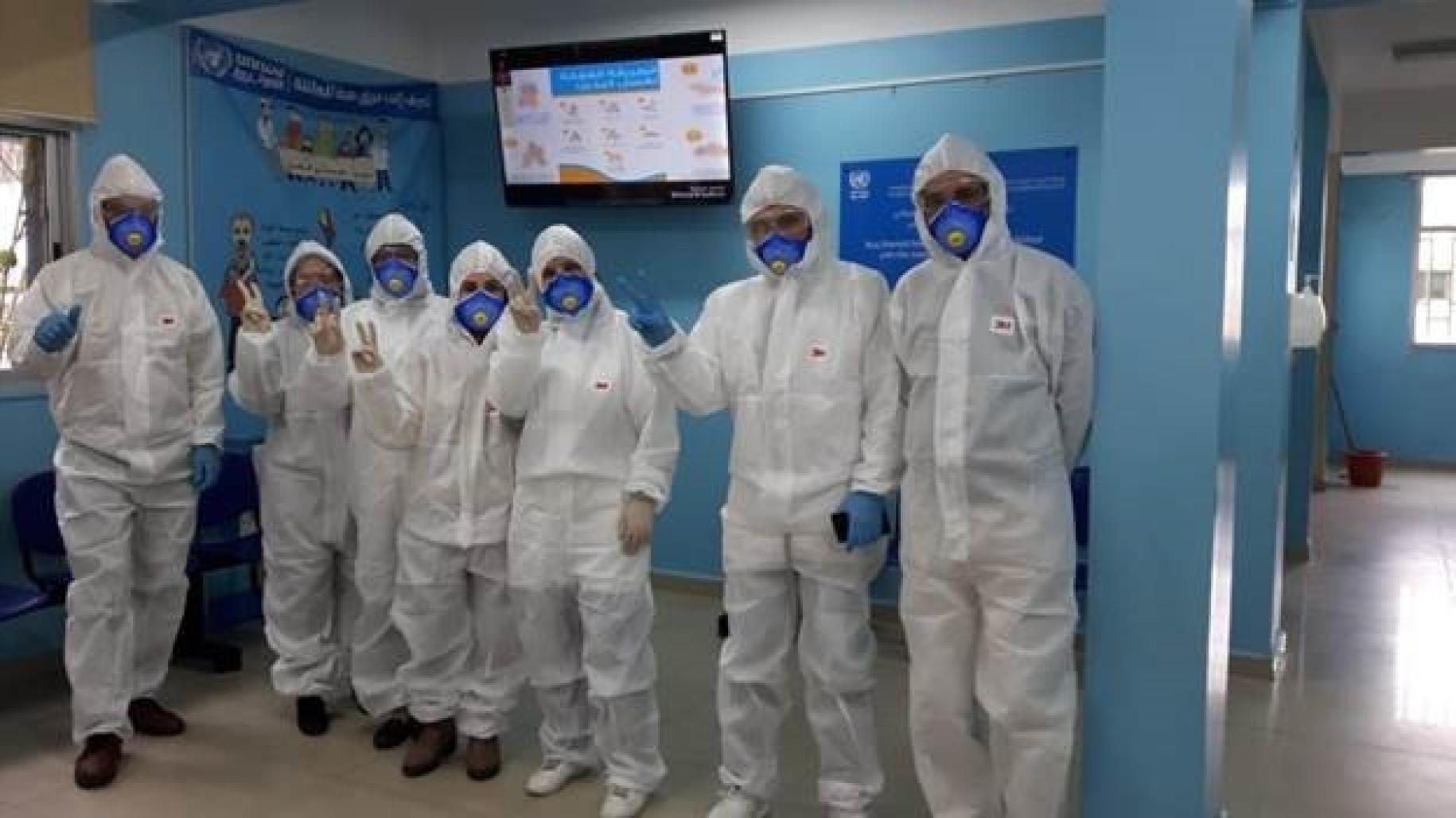 Medical staff at UNRWA's vital health centres proudly wear head-to-toe personal protective equipment. 