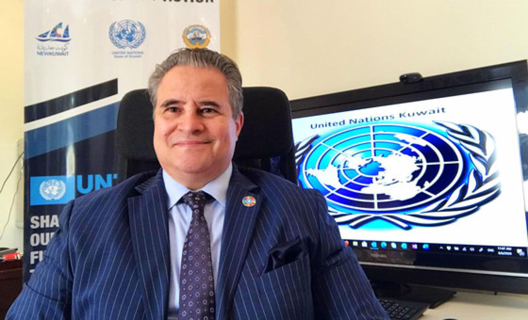 Tarek Azmi Elsheikh, United Nations Resident Coordinator in Kuwait smiles at the camera.