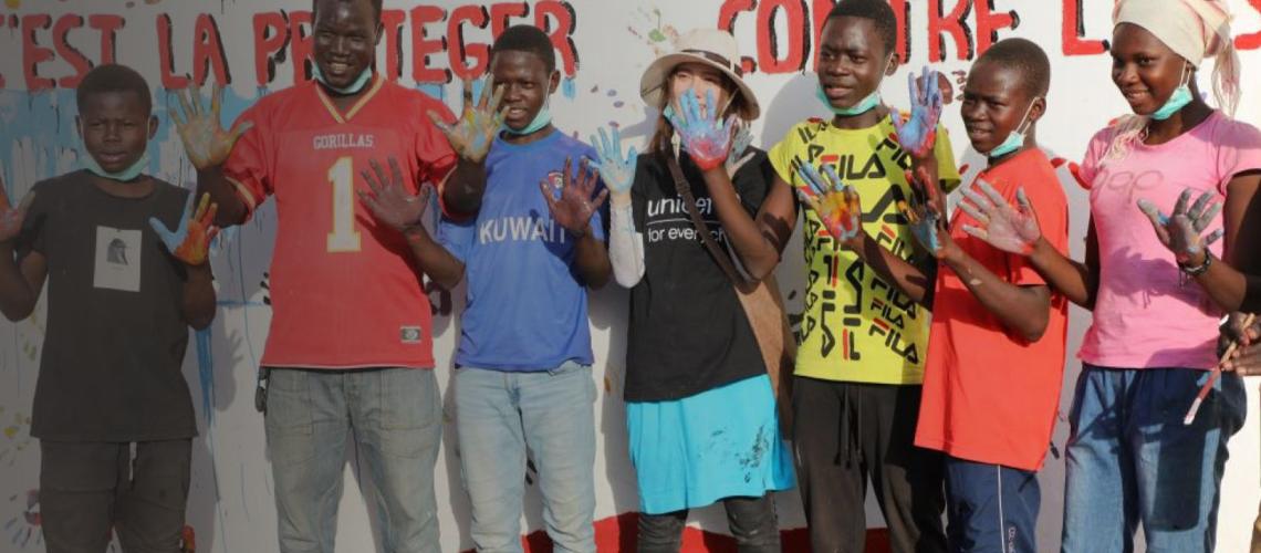 Young people show their painted hands. They took part in a painting workshop in celebration of World AIDS Day.