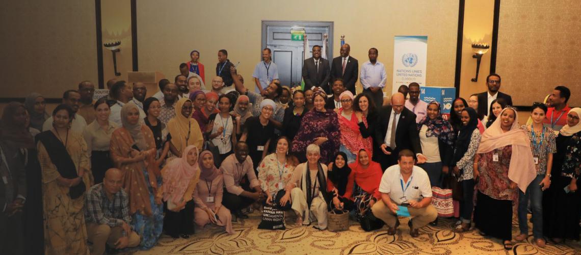DSG Amina Mohammed and staff members pose for a group photo at a UN Townhall in Djibouti.